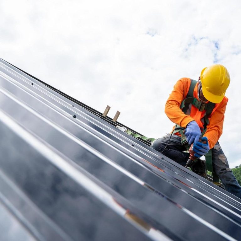 man on roof working - roofing services in Cheltenham glos roofer working on roof - for emergency roofing services in cheltenham